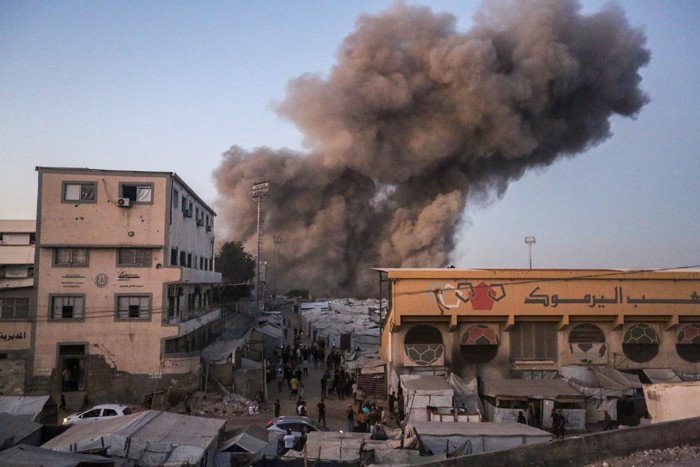 GAZA CITY, GAZA - JULY 28: Smoke from an explosion can be seen after an Israeli attack on July 28, 2026 in Gaza City, Gaza. According to witnesses, one person was injured and homes damaged when an Israeli strike reportedly targeted the Al-Muttaqin Mosque, near the Yarmouk Stadium camp for displaced people in Gaza City. Israel has continued to bomb Gaza despite the US-brokered ceasefire deal, accusing Hamas of rearming and rebuilding its forces. (Photo by Ahmad Hasaballah/Getty Images)