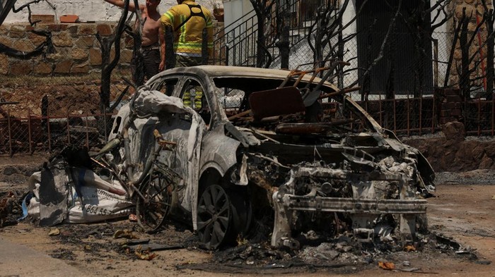 Damaged property in a burned area, as wildfires continue to affect the provinces of Avila and Madrid, in El Encinar del Alberche, Toledo, Spain, July 27, 2026. REUTERS/Violeta Santos Moura