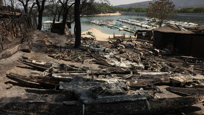 Damaged property in a burned area, as wildfires continue to affect the provinces of Avila and Madrid, in El Encinar del Alberche, Toledo, Spain, July 27, 2026. REUTERS/Violeta Santos Moura