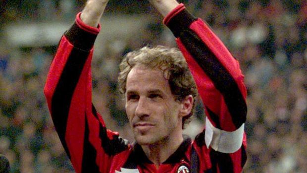 FILE PHOTO: Franco Baresi shows a present that he received from Silvio Berlusconi before a friendly match A.C. Milan vs All Stars, October 28. Franco Baresi leaves the football world tonight. SPORT SOCCER MILANO/File Photo