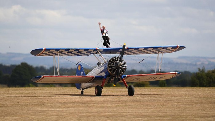 97-year-old Betty Bromage after a successful attempt to break the Guinness World Record for the oldest female wing-walker, with her sixth wing walk, at RFC Rendcomb Airfield near Cirencester, Gloucestershire. Picture date: Tuesday August 4, 2026. (Ph
