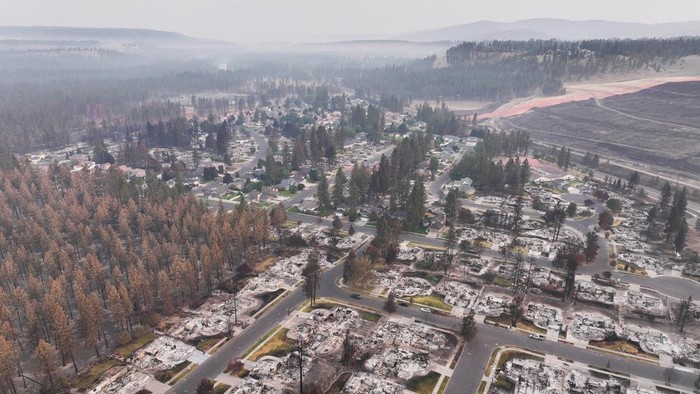 A drone view shows a neighborhood burned by the Old Trails Fire in Spokane, Washington, U.S., August 10, 2026.  REUTERS/David Ryder