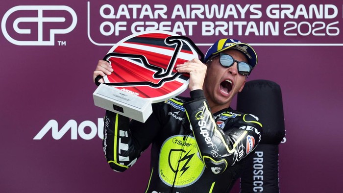 MotoGP - British Grand Prix - Silverstone Circuit, Silverstone, Britain - August 9, 2026 SuperFile Trackhouse MotoGP Teams Raul Fernandez celebrates with his trophy on the podium after winning the MotoGP race REUTERS/Paul Childs