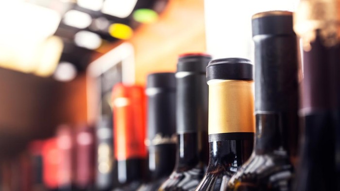 Bottles of wine on the shelves of an alcohol shop in Spain, Alicante. Background