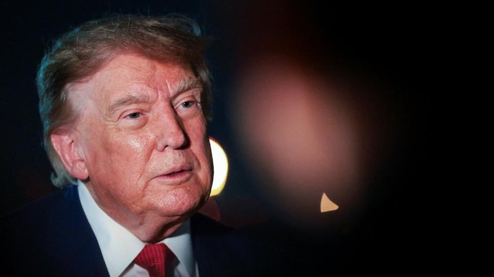 U.S. President Donald Trump looks on as he speaks to members of the media after disembarking Air Force One at Joint Base Andrews, Maryland, U.S., August 11, 2026. REUTERS/Kylie Cooper