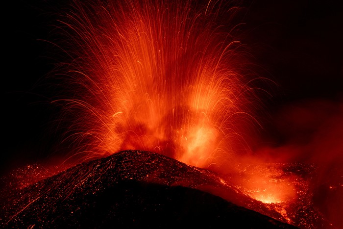 Incandescent lava and volcanic material are ejected from a crater during an eruption of Mount Etna, in Sicily, Italy, August 13, 2026. REUTERS/Giuseppe Di Stefano     TPX IMAGES OF THE DAY