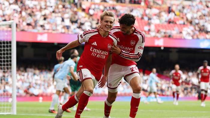 Soccer Football - FA Community Shield - Arsenal v Manchester City - Principality Stadium, Cardiff, Wales, Britain - August 16, 2026 Arsenals Martin Odegaard celebrates scoring their third goal with Kai Havertz REUTERS/Chris Radburn