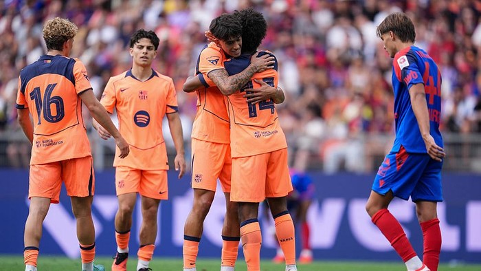 BASEL, SWITZERLAND - AUGUST 16:  Karim Adeyemi of FC Barcelona (R) celebrates the first team goal with teammates  during the pre-season friendly match between FC Basel and FC Barcelona at St. Jakob-Park on August 16, 2026 in Basel, Switzerland. (Photo by Daniela Porcelli/Getty Images)