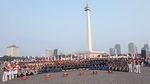 Isra Mashel Pimpin Drum Corps Pelopor Cenderawasih di Kirab Bendera Merah Putih