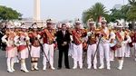 Isra Mashel Pimpin Drum Corps Pelopor Cenderawasih di Kirab Bendera Merah Putih