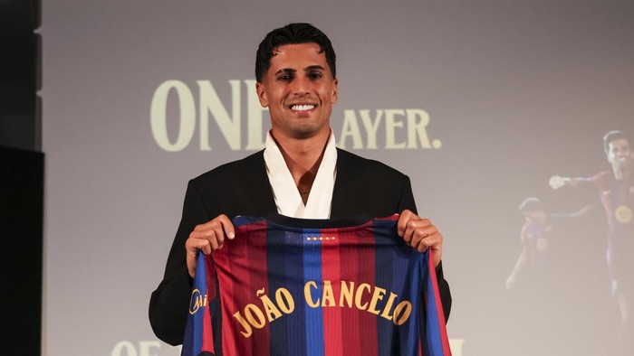 BARCELONA, SPAIN - AUGUST 20: Joao Cancelo poses in his shirt after signing his new contract as a new FC Barcelona player during his presentation at Commercial Office on August 20 2026 in Barcelona, Spain. (Photo By Javier Borrego/Europa Press via Getty Images)