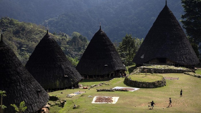 Children play soccer in front of ‘Mbaru Niang’, a traditional house of Wae Rebo, as the village is temporarily closed for visitors following an earthquake, in Manggarai regency, East Nusa Tenggara province, Indonesia, August 20, 2026. REUTERS/Willy Kurniawan