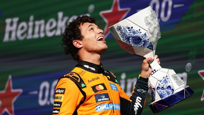 ZANDVOORT, NETHERLANDS - AUGUST 23: Race winner Lando Norris of Great Britain and McLaren celebrates on the podium with his trophy during the F1 Grand Prix of Netherlands at Circuit Zandvoort on August 23, 2026 in Zandvoort, Netherlands. (Photo by Ma