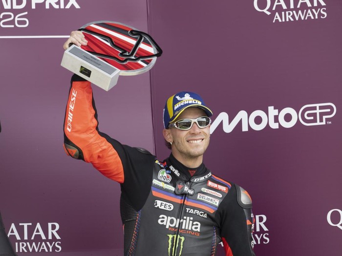 NORTHAMPTON, ENGLAND - AUGUST 09: Marco Bezzecchi of Italy and Aprilia Racing celebrates the third place on the podium during the MotoGP race during the MotoGP Of Great Britain - Race at Silverstone Circuit on August 09, 2026 in Northampton, England.