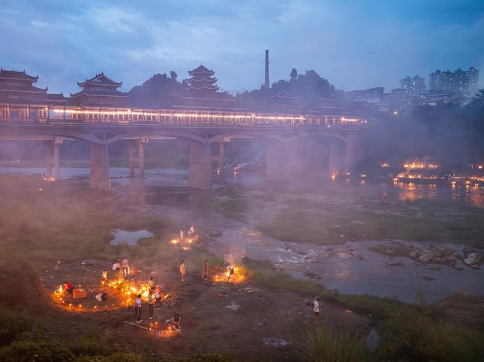 KAILI, CHINA - AUGUST 25: People burn paper offerings in designated areas to pay tribute to their departed loved ones ahead of the Zhongyuan Festival (Ghost Festival) on August 25, 2026 in Kaili, Guizhou Province of China. The Ghost Festival, also known as Zhongyuan Festival, is a traditional festival for paying respect to the dead. (Photo by Fu Yujianglin/VCG via Getty Images)