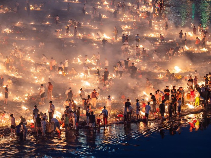KAILI, CHINA - AUGUST 25: People burn paper offerings in designated areas to pay tribute to their departed loved ones ahead of the Zhongyuan Festival (Ghost Festival) on August 25, 2026 in Kaili, Guizhou Province of China. The Ghost Festival, also known as Zhongyuan Festival, is a traditional festival for paying respect to the dead. (Photo by Fu Yujianglin/VCG via Getty Images)