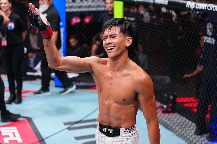 SHANGHAI, CHINA - AUGUST 29: Bilal Hasan punches Nilson Rojas of Peru in a flyweight fight during the UFC Fight Night event at SPD Bank Oriental Sports Center on August 29, 2026 in Shanghai, China.  (Photo by Chris Unger/Zuffa LLC)
