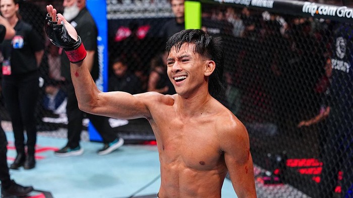 SHANGHAI, CHINA - AUGUST 29: Bilal Hasan punches Nilson Rojas of Peru in a flyweight fight during the UFC Fight Night event at SPD Bank Oriental Sports Center on August 29, 2026 in Shanghai, China.  (Photo by Chris Unger/Zuffa LLC)