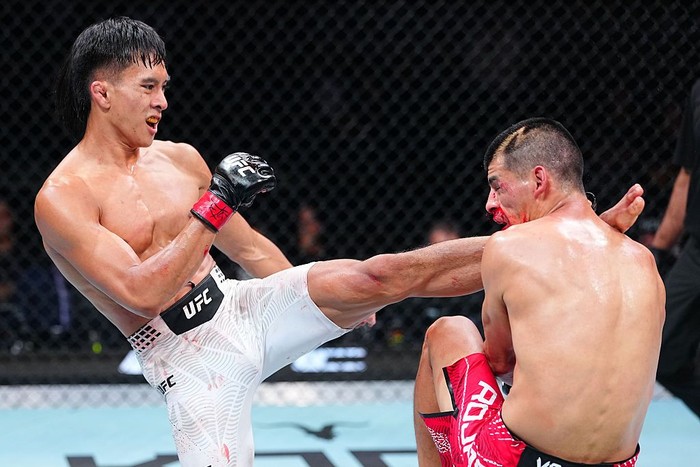 SHANGHAI, CHINA - AUGUST 29: Bilal Hasan punches Nilson Rojas of Peru in a flyweight fight during the UFC Fight Night event at SPD Bank Oriental Sports Center on August 29, 2026 in Shanghai, China.  (Photo by Chris Unger/Zuffa LLC)