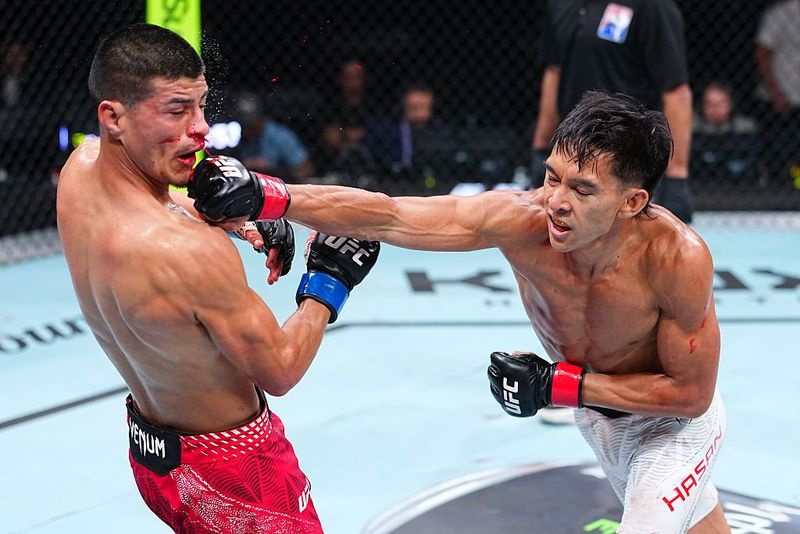 SHANGHAI, CHINA - AUGUST 29: Bilal Hasan punches Nilson Rojas of Peru in a flyweight fight during the UFC Fight Night event at SPD Bank Oriental Sports Center on August 29, 2026 in Shanghai, China.  (Photo by Chris Unger/Zuffa LLC)