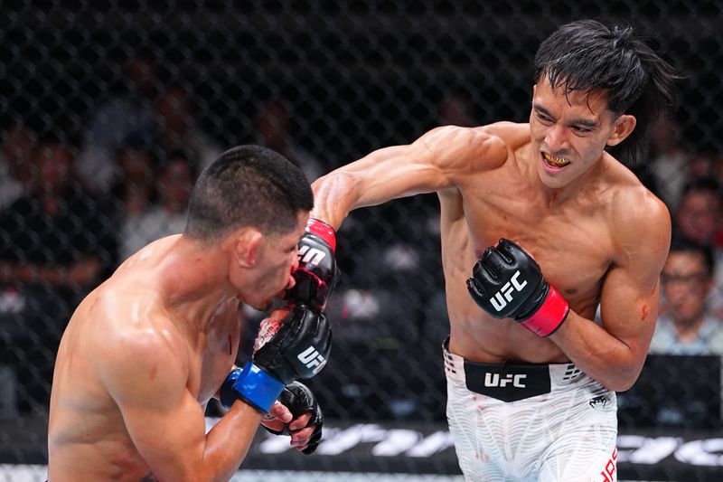 SHANGHAI, CHINA - AUGUST 29: Bilal Hasan knocks out Nilson Rojas of Peru in a flyweight fight during the UFC Fight Night event at SPD Bank Oriental Sports Center on August 29, 2026 in Shanghai, China.  (Photo by Chris Unger/Zuffa LLC)