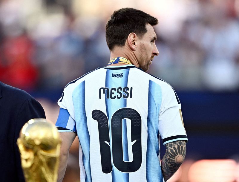 FILE PHOTO: Soccer Football - FIFA World Cup 2026 - Final - Spain v Argentina - New York/New Jersey Stadium, East Rutherford, New Jersey, U.S. - July 19, 2026 Argentina's Lionel Messi looks dejected after receiving his runners up medal on the podium after losing the World Cup Final REUTERS/Dylan Martinez/File Photo