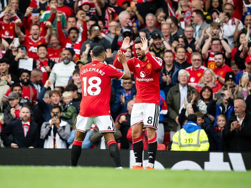 MANCHESTER, ENGLAND - AUGUST 30:   Bruno Fernandes of Manchester United celebrates scoring his team's first goal with Youri Tielemans during the Premier League 2026/27 match between Manchester United and Ipswich Town at Old Trafford on August 30, 2026 in Manchester, United Kingdom. (Photo by Ash Donelon/Manchester United via Getty Images)