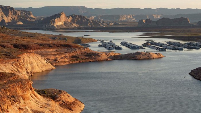 Early morning sunlight hits the canyon walls of Lake Powell near Wahweap Marina, as the critical reservoir sits at its lowest ever recorded water level, in Glen Canyon National Recreation Area near Page, Arizona, U.S. August 30, 2026.  REUTERS/Rebecca Noble