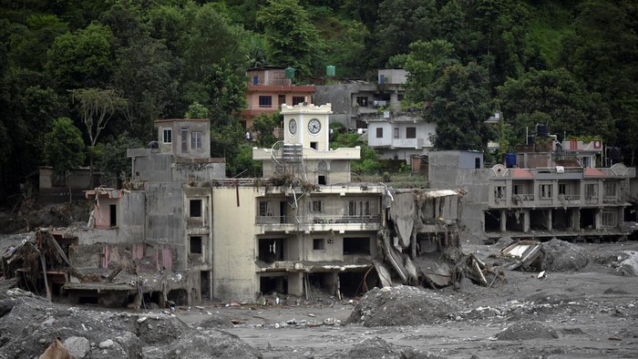 Damaged buildings near Trishuli River following deadly flash floods and a mudslide, in Betrawati Bazaar in Rasuwa district, Nepal, August 30, 2026. REUTERS/Stringer