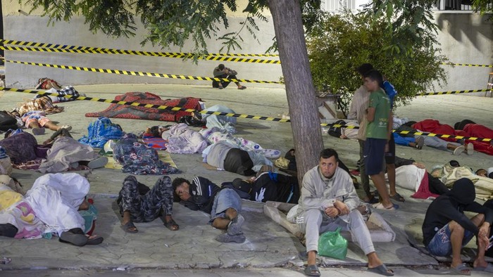 CEUTA, SPAIN - SEPTEMBER 01: Migrants continue to sleep in the vicinity of Loma Colmenar, on 1 September 2026, in Ceuta, Spain. Dozens of people spent the night in the vicinity of Loma Colmenar, despite the intervention of the National Police after hundreds of Maghreb migrants attempted to enter the city en masse. The situation necessitated the deployment of a large police operation, which carried out charges to contain the crowd and fired warning shots into the air in order to bring the situation under control. (Photo By Marcos Moreno/Europa Press via Getty Images)