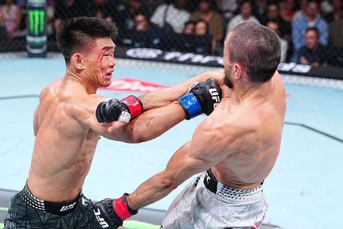 SHANGHAI, CHINA - AUGUST 29: (L-R) Song Yadong of China punches Umar Nurmagomedov of Russia in a bantamweight fight during the UFC Fight Night event at SPD Bank Oriental Sports Center on August 29, 2026 in Shanghai, China.  (Photo by Chris Unger/Zuff