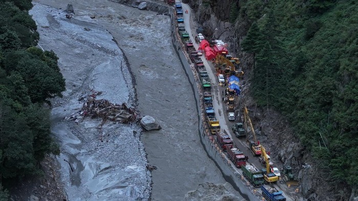 A drone view shows excavators and rescue equipment at the core disaster-hit area at Gyirong Port following the August 26 mudslide, in Shigatse, Tibet Autonomous Region, China September 1, 2026. cnsphoto via REUTERS   ATTENTION EDITORS - THIS IMAGE WA