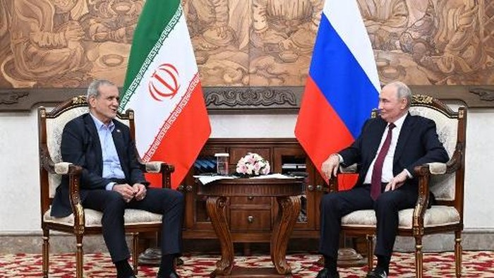 In this pool photograph distributed by the Russian state agency Sputnik, Russias President Vladimir Putin and Irans President Masoud Pezeshkian hold a meeting on the sidelines of the Shanghai Cooperation Organisation (SCO) summit in Bishkek on Sept
