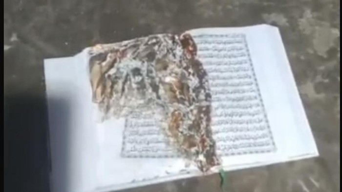 Tangkapan layar video Al-Quran dibakar pria di Muncar, Banyuwangi lalu diunggah ke status WhatsApp