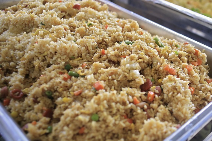 Nasi Goreng Kampung, fried rice  garnished with Carrots, sausage.