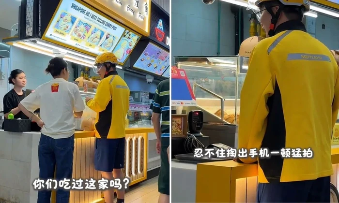 Kurir pengantar makanan ambil pesanan di Singapura
