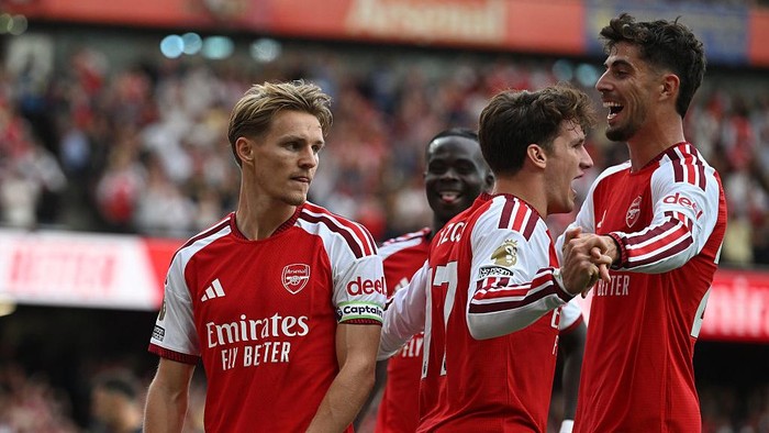 LONDON, ENGLAND - SEPTEMBER 06: (L) Martin Odegaard celebrates scoring the 2nd Arsenal goal with (2ndL) Christos Tzolis and (R) Kia Havertz during the Premier League 2026/27 match between Arsenal FC and Chelsea FC at Emirates Stadium on September 06, 2026 in London, England. (Photo by Stuart MacFarlane/Arsenal FC via Getty Images)