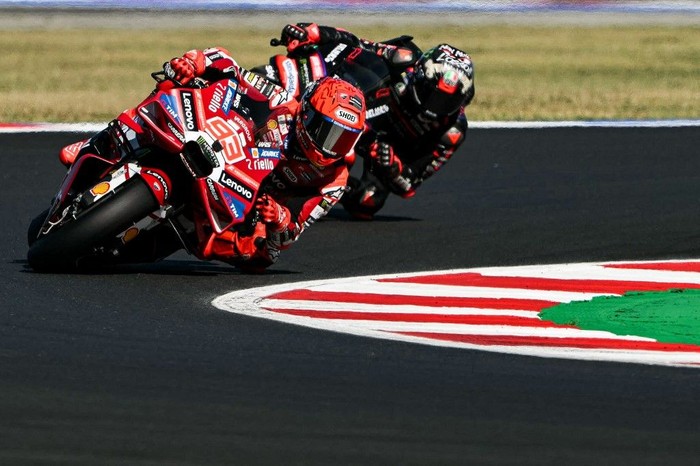 Ducati Lenovo Teams Spanish rider Marc Marquez corners during the San Marino Moto GP Sprint Race at the Misano World Circuit Marco Simoncelli, in Misano Adriatico, northern Italy on September 12, 2026.  (Photo by Andreas SOLARO / AFP)