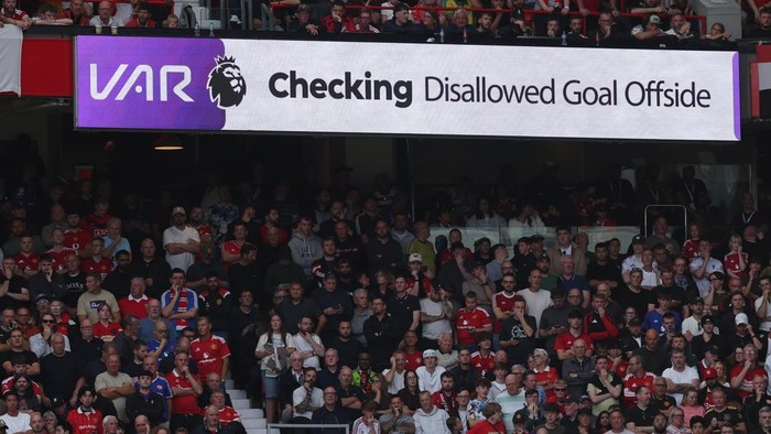 MANCHESTER, ENGLAND - SEPTEMBER 13: A VAR Checking message is seen on an LED board before leading to Erling Braut Haaland of Manchester City being awarded their sides first goal during the Premier League 2026/27 match between Manchester United and Manchester City at Old Trafford on September 13, 2026 in Manchester, England. (Photo by Alex Livesey - Danehouse/Getty Images)