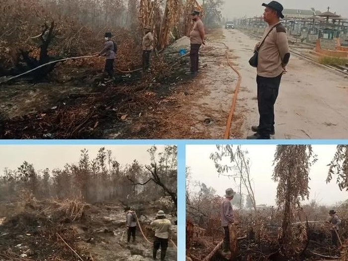 Personel Polsek Pahandut turun langsung melakukan pemadaman karhutla.