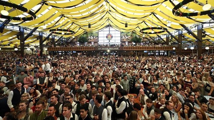 Visitors gather on the day of the official opening of the 191st Oktoberfest, the world's largest beer festival in Munich, Germany, September 19, 2026. REUTERS/Angelika Warmuth