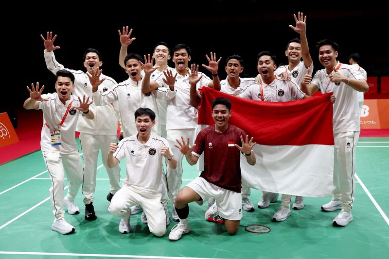 Asian Games - Aichi-Nagoya 2026 - Badminton - Men's Team Final - Gold Medal - Indonesia v China - Ichinomiya City Municipal Gymnasium, Ichinomiya, Japan - September 24, 2026 Indonesia's Moh Zaki Ubaidillah celebrates with teammates after winning his match against China's Hongyang Weng to win gold in the Badminton Men's Team Final REUTERS/Eloisa Lopez