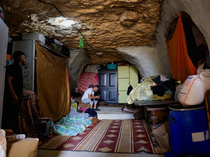 People check the damage after Israeli heavy machinery demolished homes in Jinba village in Masafer Yatta, near Hebron, in the Israeli-occupied West Bank, September 23, 2026. REUTERS/Mussa Qawasma