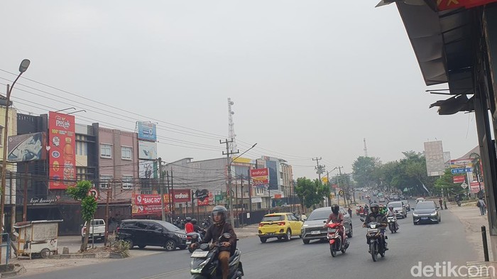 Kondisi kabut asap yang masih menyelimuti Kota Palembang