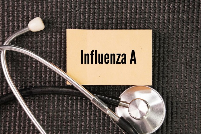 Stethoscope and paper with the word influenza A. viruses predominant among the viruses detected globally. a virus in the Orthomyxovirida virus family and the only virus species in the Alphainfluenzavirus genus.