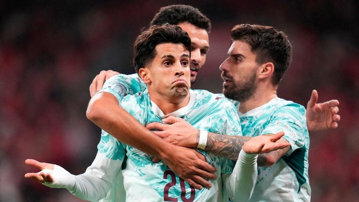 Soccer Football - UEFA Nations League - Group A4 - Denmark v Portugal - Parken, Copenhagen, Denmark - October 1, 2026 Portugals Joao Cancelo celebrates scoring their first goal Liselotte Sabroe/Ritzau Scanpix via REUTERS      ATTENTION EDITORS - THIS IMAGE WAS PROVIDED BY A THIRD PARTY. DENMARK OUT. NO COMMERCIAL OR EDITORIAL SALES IN DENMARK.     TPX IMAGES OF THE DAY