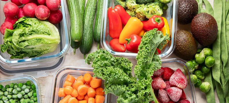 Ilustrasi sayuran Glass containers with different fresh products such vegetables and fruits on a light background. Top view. Panorama.