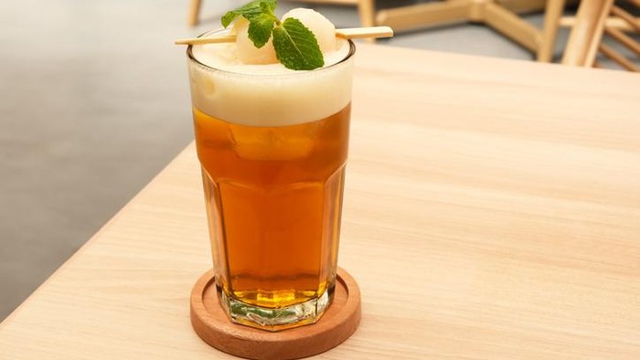 Lychee iced tea on the table, blurred background
