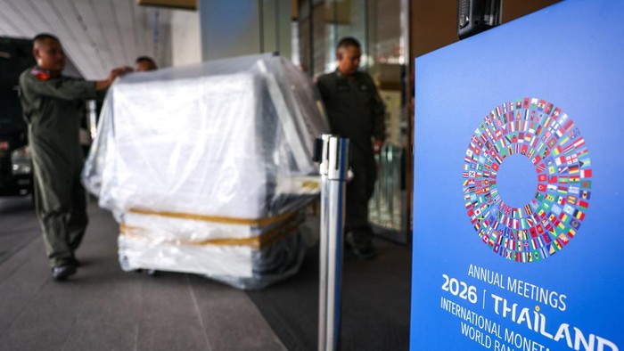 A worker cleans next to the logo of the 2026 IMF-World Bank Annual Meetings, ahead of the meeting at Queen Sirikit National Convention Center (QSNCC), in Bangkok, Thailand, October 9, 2026. REUTERS/Athit Perawongmetha