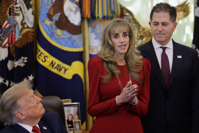 Michael Dell looks on as Susan Dell speaks on the day US President Donald Trump makes an announcement regarding personal investment accounts for children in the Oval Office at the White House in Washington, D.C., US, October 7, 2026. REUTERS/Jonathan Ernst